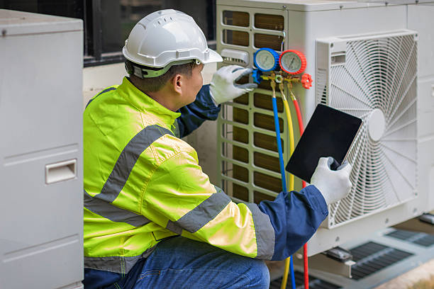 Professional Air Duct Cleaning technician working in Greenville, RI